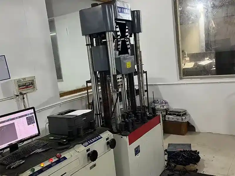 Tensile testing machine tests mechanical performance of DIN933 hex bolts